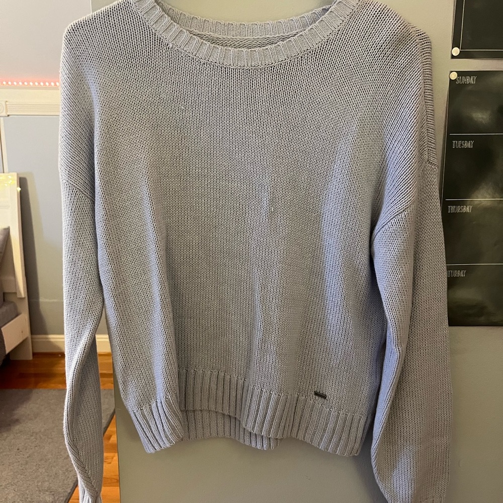 Light blue woman’s Hollister sweater. Brand new with tags. Size XS.